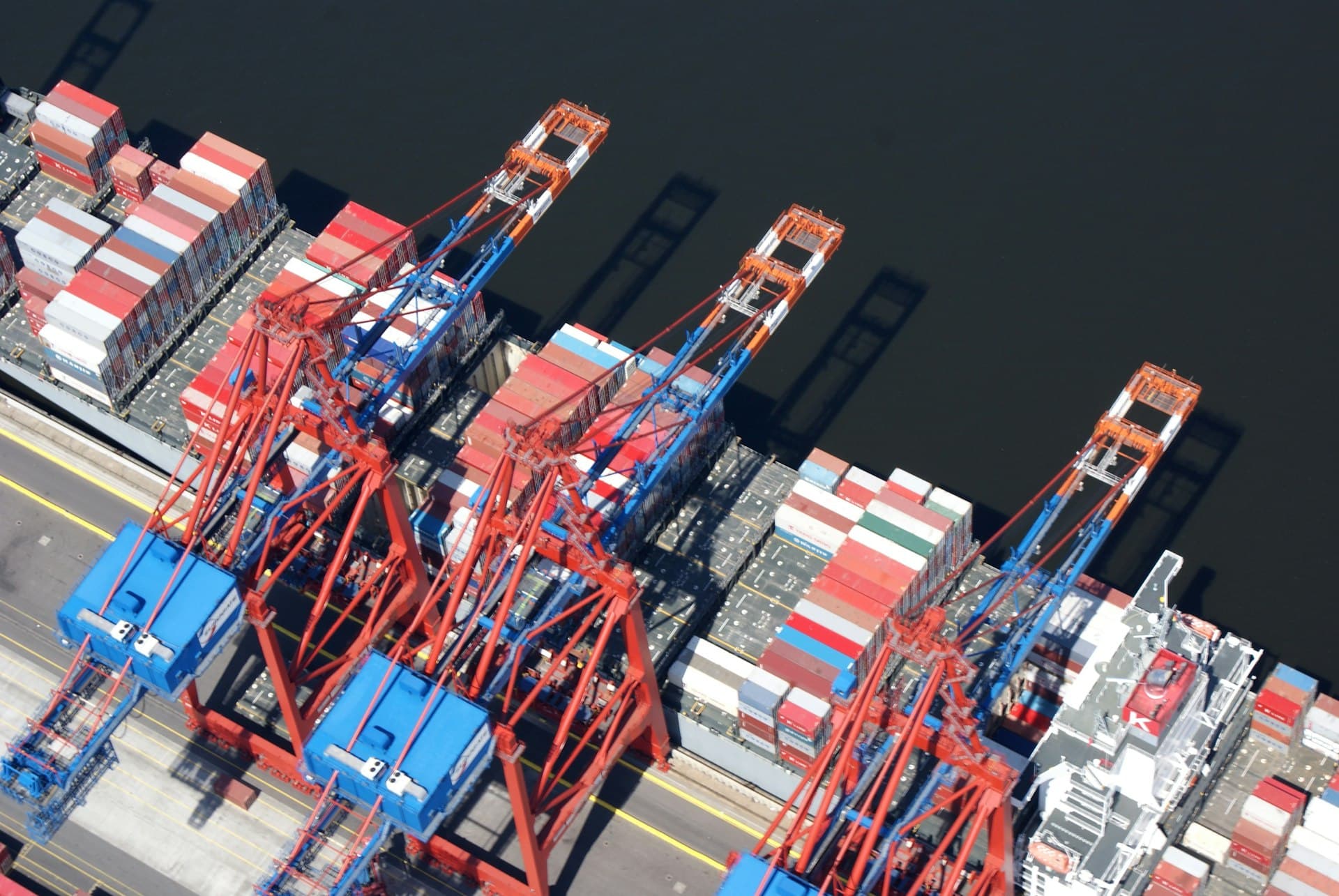 Aerial view of a container ship being loaded at a terminal