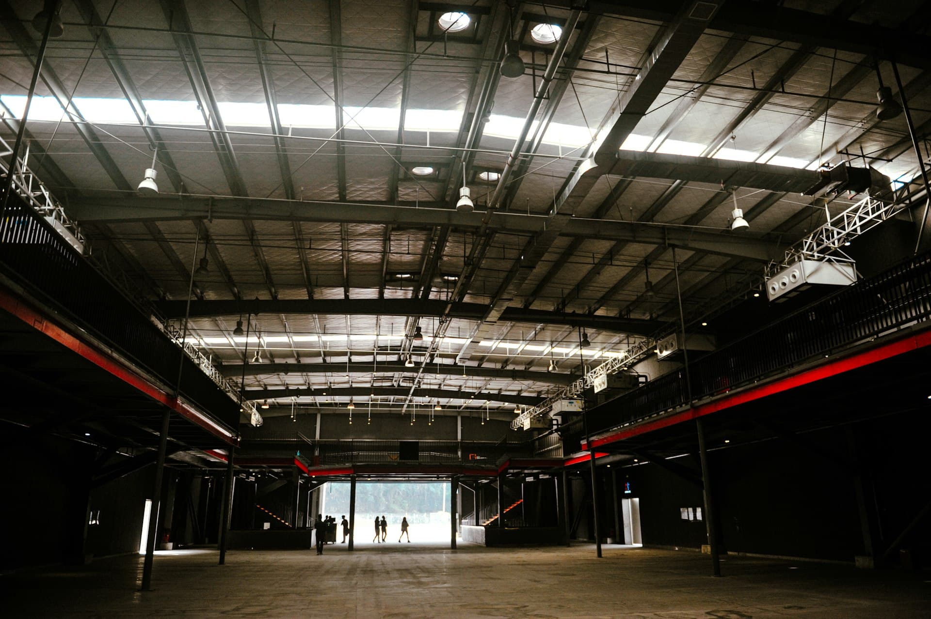 Large warehouse interior with overhead lighting